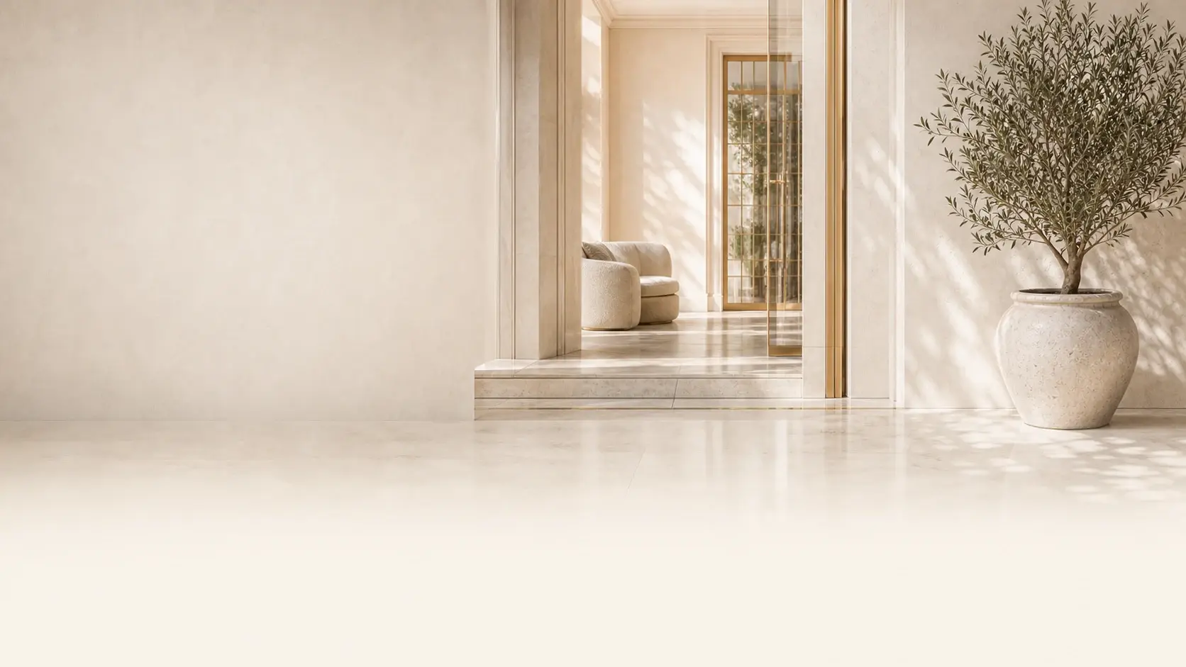 Umbral residencial conceptual con luz natural, piedra clara y detalles de latón.